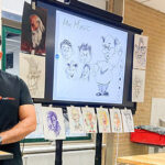 Cartoon tekenen met workshopleider voor jongeren.